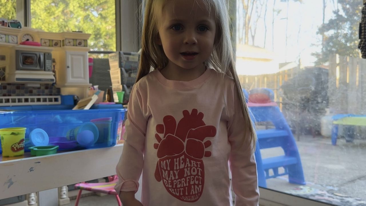 Charley Grace wearing a shirt representing CHD.